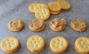 Ritz cracker spread with peanut butter