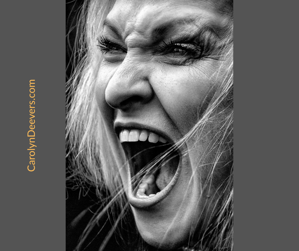 Woman screaming with unfiltered rage